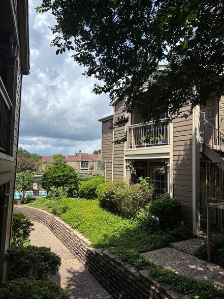 Outdoor view of front of unit adjacent to pool - 1860 White Oak Dr