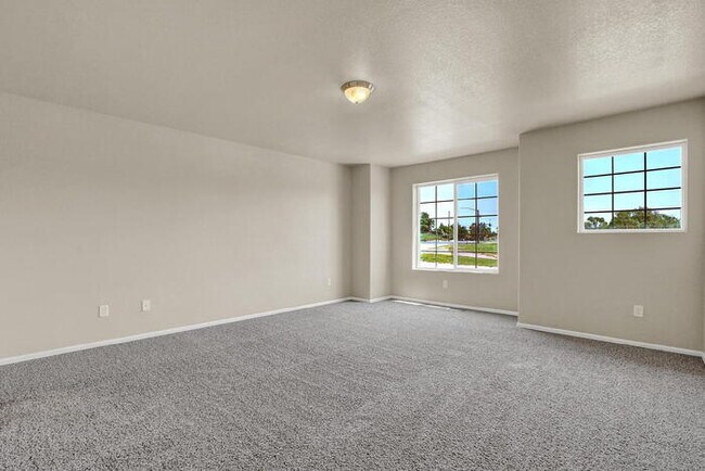 Building Photo - Modern Townhome with Central A/C, 2-Car Ga...