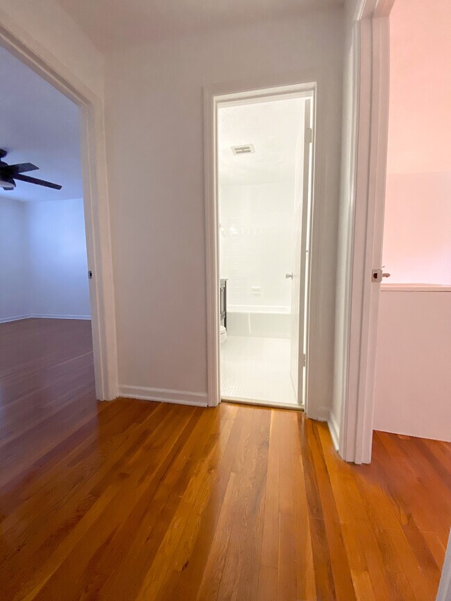 top of stairs looking into bathroom - 506 N Greensboro St