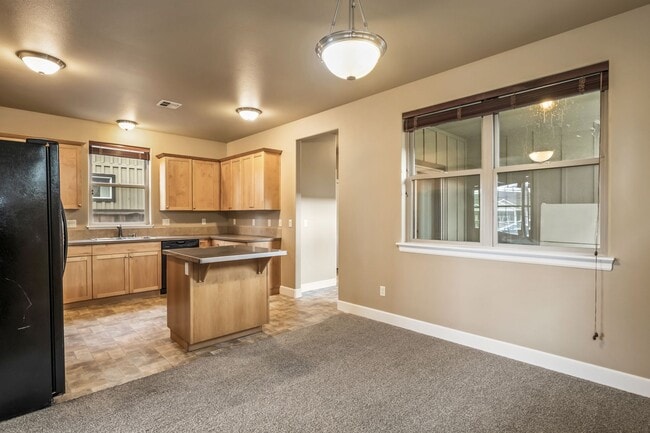 Building Photo - Spacious 4-Bedroom Home with New Paint & Carpet, Fenced Yard