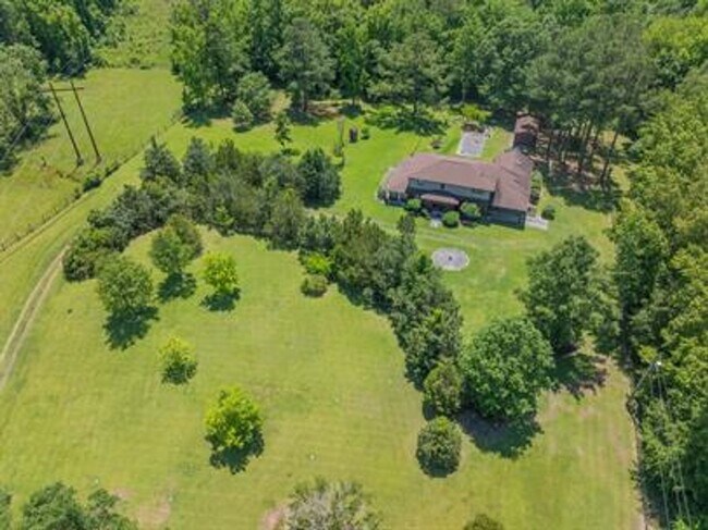 Building Photo - Uniquely breathtaking custom home with in-...