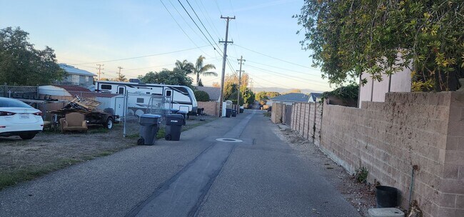 Building Photo - This is a spacious house featuring four bedrooms and two bathrooms, along with a two-car garage.