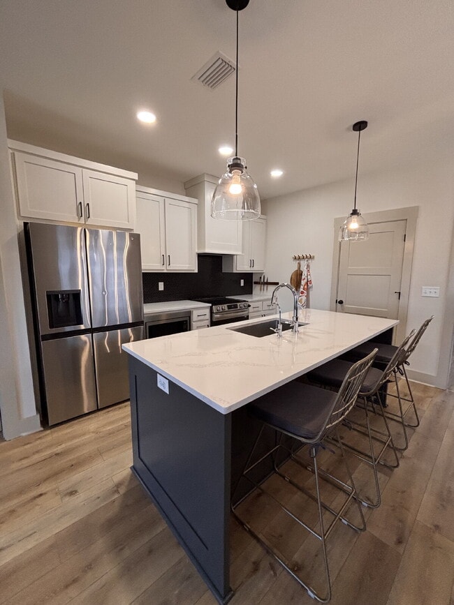 Building Photo - Need Space?  How about 5 bedrooms, 2.5 baths + an extra bonus area upstairs so that the kids can ...