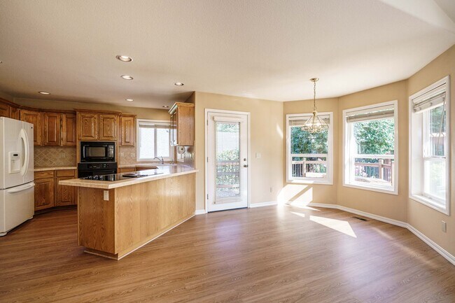 Building Photo - Beautifully Landscaped 1/4 acre with Well Maintained 4 bedroom 2 Bath Home with 3 Car Garage