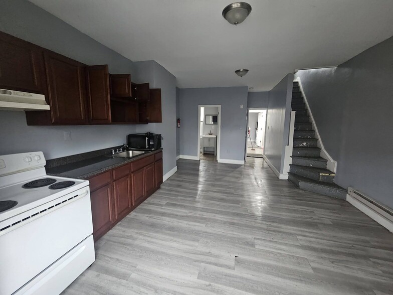 Kitchen/Living Room facing stairs to upstairs - 5210 Master St