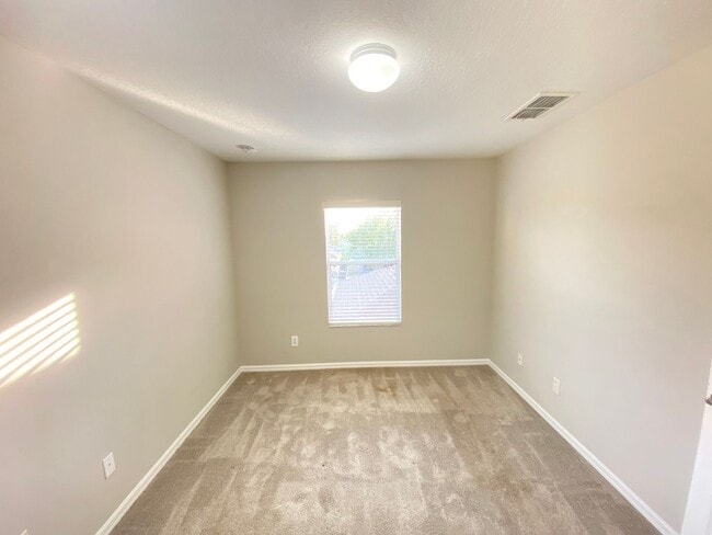 Building Photo - Avalon Park corner end Townhome featuring 3 bedrooms, 2.5 baths, plus office, and 2 car garage.