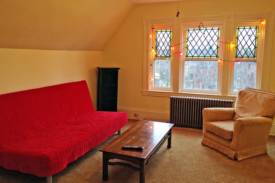 Living Room with futon that converts to bed. - 827 N. Highland Ave.