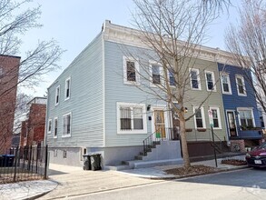 Building Photo - STUNNINGLY RENOVATED 5BR/2BA END UNIT ROW ...