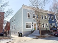 Building Photo - STUNNINGLY RENOVATED 5BR/2BA END UNIT ROW ...