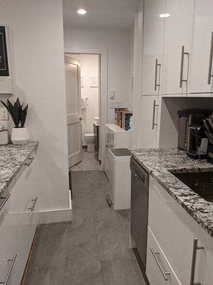 Kitchen leading into hallway and bathroom - 12 Melrose St