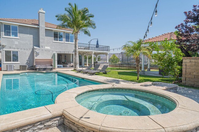Building Photo - Spectacular 5-Bedroom Home with Pool, RV P...