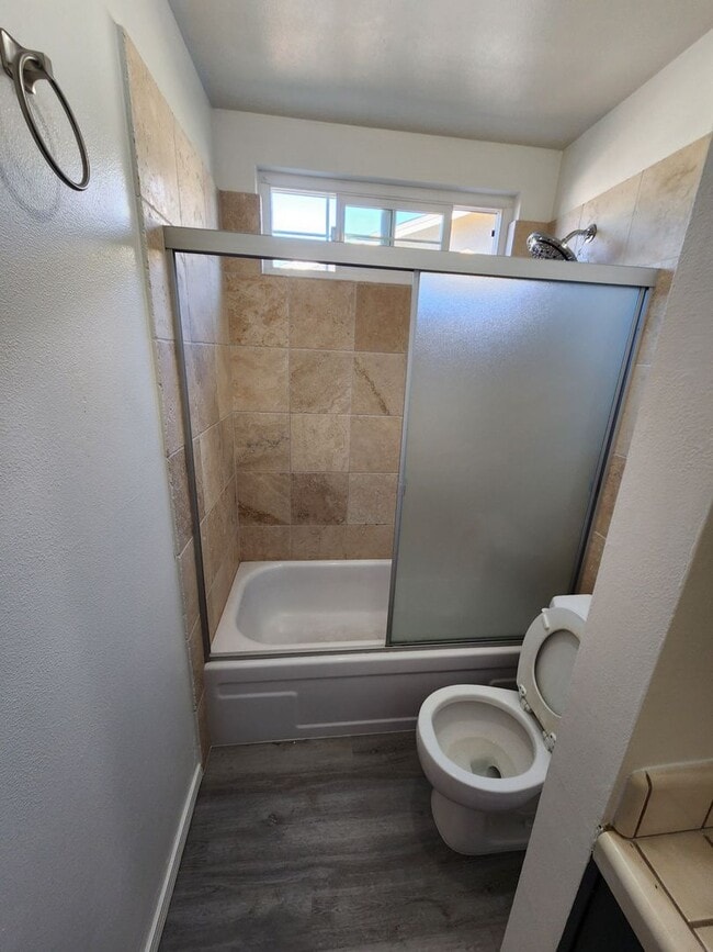 Building Photo - Adorable 4/2 With GREAT Backyard.  Gardene...