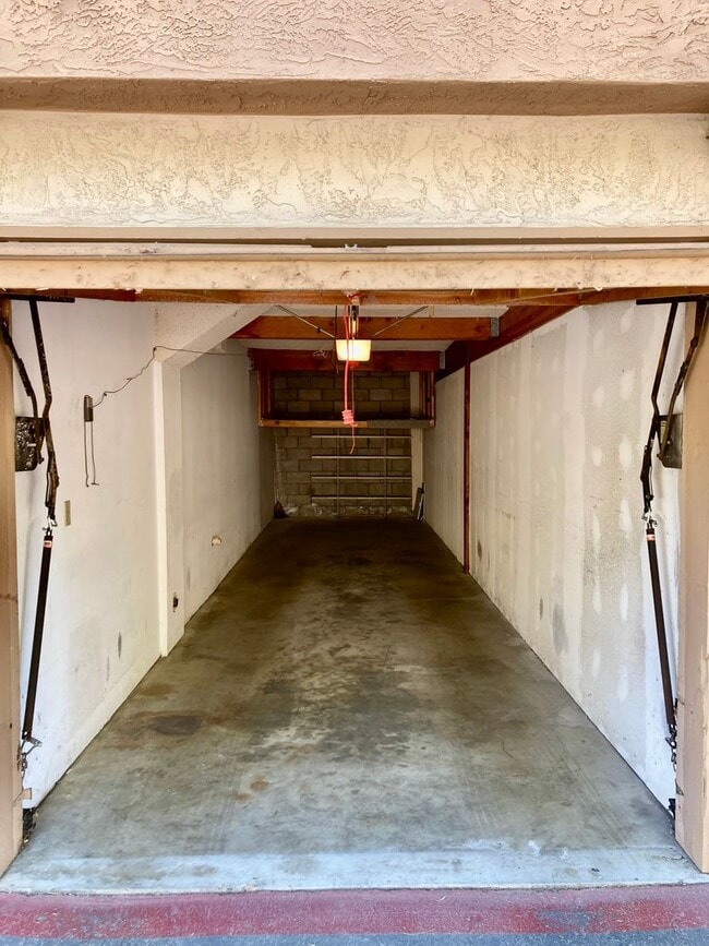 Building Photo - One Bedroom with Garage and IN-Unit laundry in Resort-Style Complex
