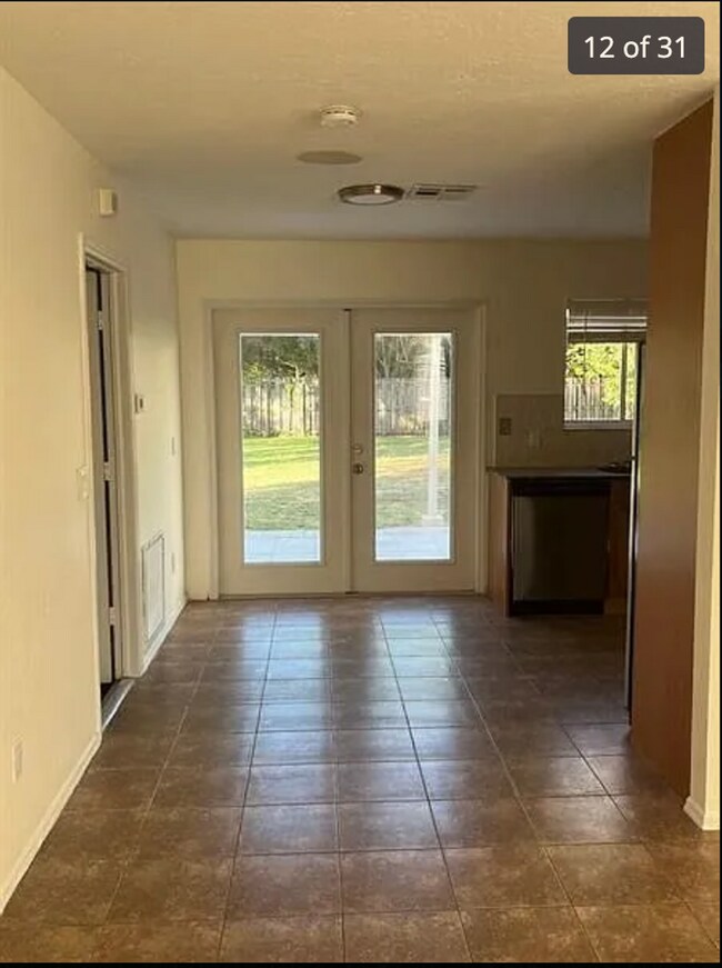Building Photo - 2/2/1 home with a spacious fenced backyard...