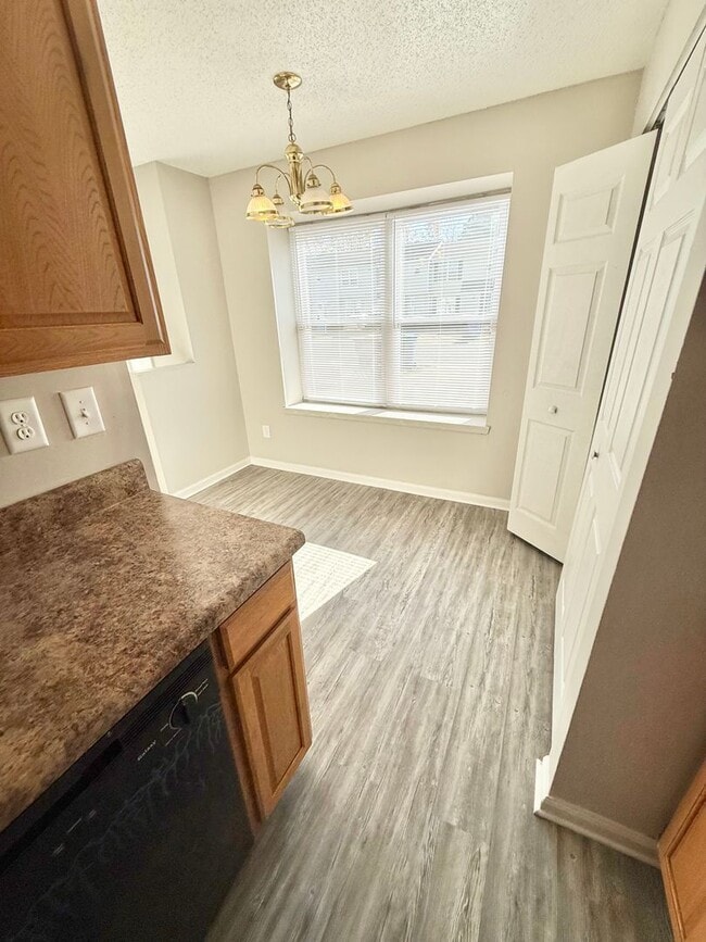 Building Photo - *** RENT READY!! Newly remodeled townhome! ALL Laminate.