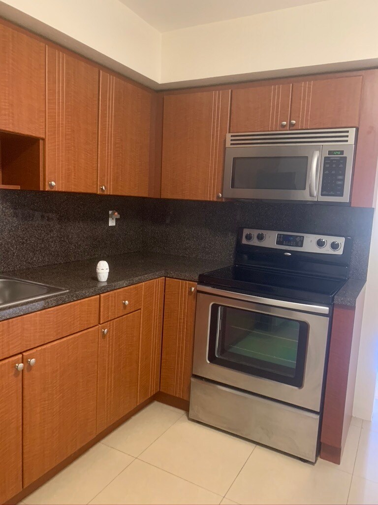 Kitchen with stainless steel appliances - 5010 SW 26th Ave