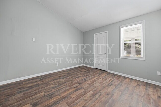 Building Photo - A Must See/ High Vaulted ceiling's & Section 8 Welcome!!!