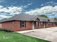 Building Photo - The Oaks: Water/Sewer Included