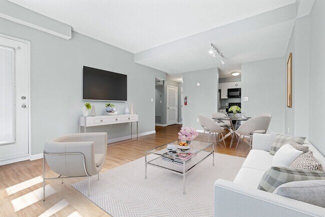 Building Photo - Updated 1BR Condo with Balcony, Garage Parking & Storage Near Commuter Rail