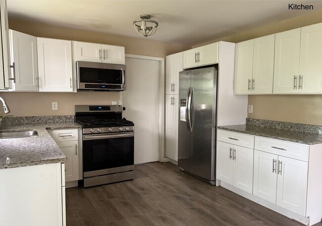 Building Photo - Newly Renovated - Spacious 4 Bedroom - 2 B...