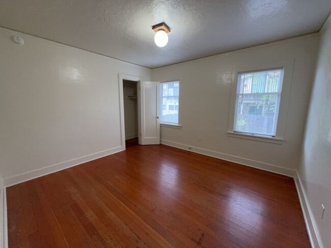 Building Photo - Sit out with your pet on the patio of this...