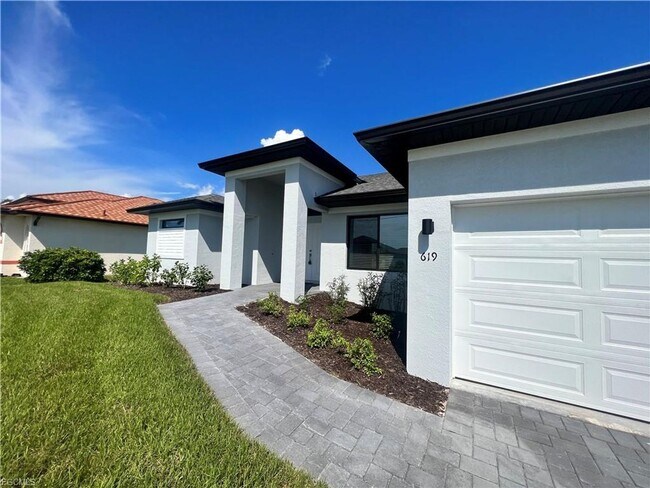 Building Photo - Stunning 4 Bed 3 Car Garage Home Available Now Near Burnt Store Rd