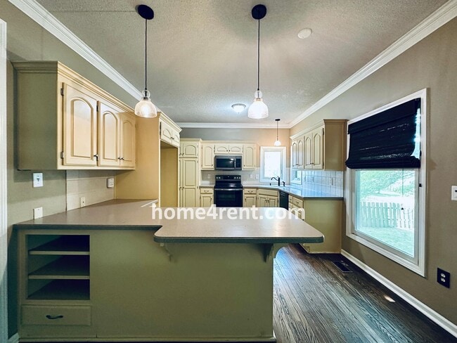 Building Photo - Blue Valley Schools w/ Wood Floors, Finished Basement and a Peaceful, Private Fenced Yard!