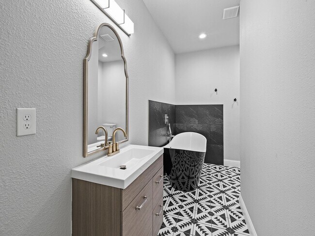 Building Photo - 4-Bedroom Townhome with Finished Basement, Garage & Private Outdoor Space