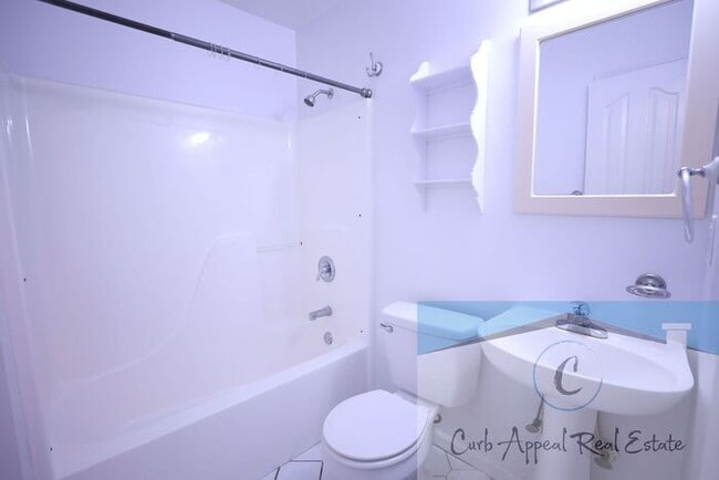 Building Photo - First month move in special $900!! Beautiful 3-bed, 2 bath condo with 2-car garage - includes was...