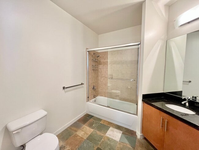 Building Photo - Stunning Corner Loft in East Village with Floor-to-Ceiling Windows & City Views!