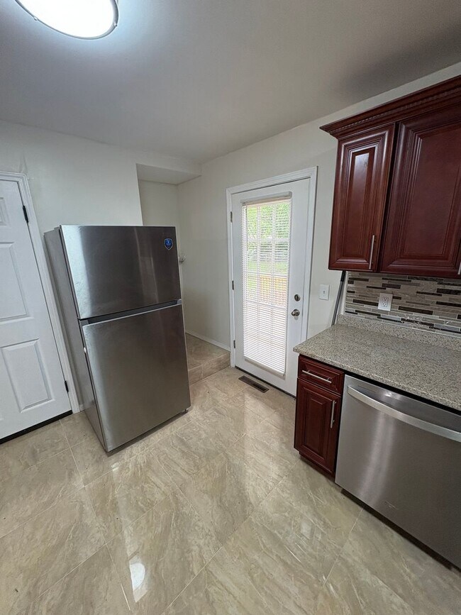 Building Photo - Cozy 3 Bedroom / 2 Bath Updated Home with Large Fenced Yard and Brand-New Multi-Level Deck