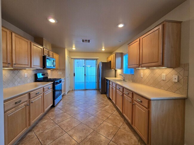 Building Photo - A Fabulous 3 Bedroom, 2.5 Bathroom, 2 Car Garage Townhome in NW Las Vegas