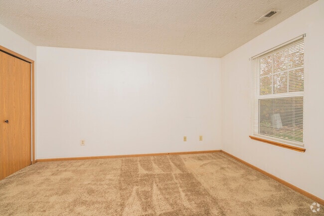 3BR, 2BA - 1,064SF - Primary Bedroom - Northcrest Apartments