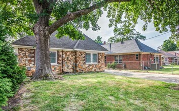 Building Photo - Live Stylishly. Live Comfortably. Live Mem...