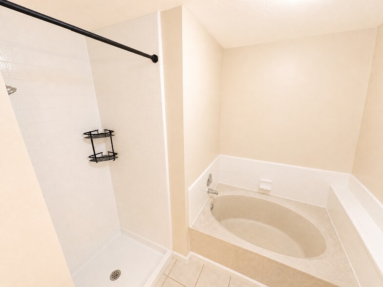 Master Bathroom with jacuzzi tub and standing shower - 12826 Careywood Dr