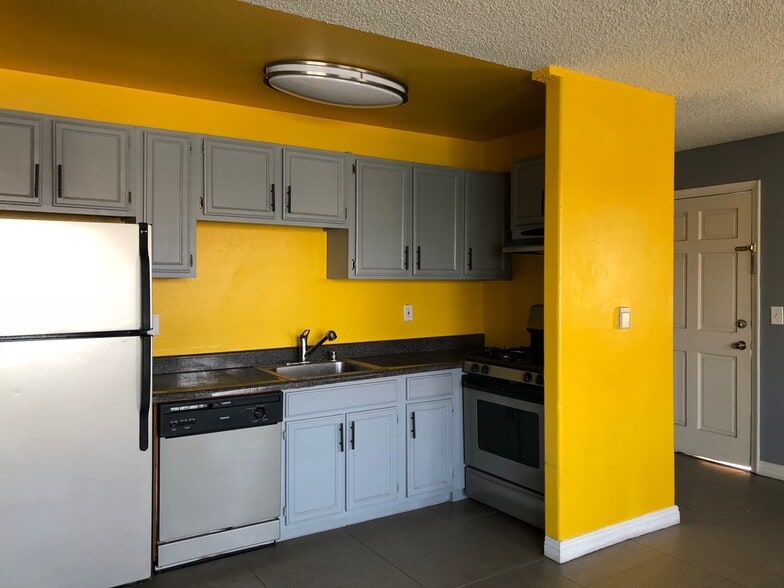 Bright yellow kitchen includes refrigerator, stove, oven & dishwasher! - 136 N Mariposa Ave