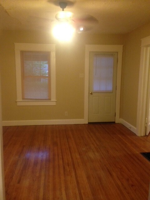 empty living room looking at front door - 207 E Vermilya Ave