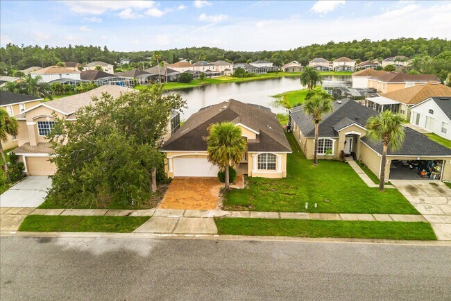 Building Photo - Stunning 4-Bedroom Lakefront Pool Home in Bridgeview at Meadow Woods