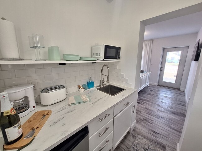 Building Photo - NSB FURNISHED EFFICIENCY UNIT-ALL UTILITIES INCLUDED INCLUDING WI-FI!