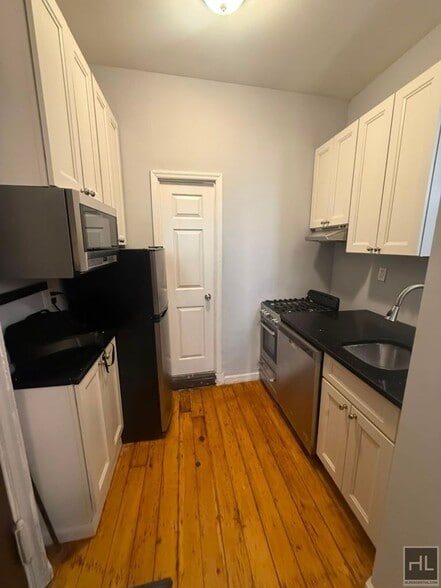Building Photo - Classic East Village One-Bedroom with Exposed Brick & High Ceilings
