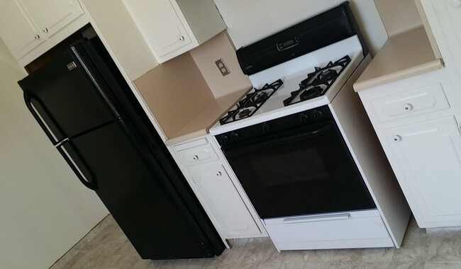 Kitchen stove & fridge - 355 S Orlando Ave