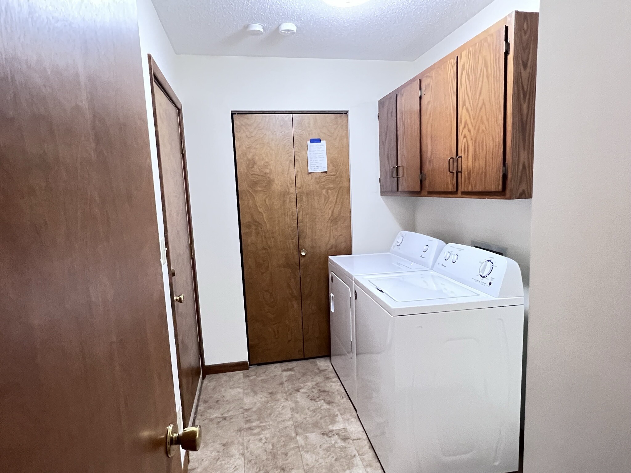 Laundry room to the left in hall - 1704 Trails Dr