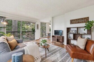 Building Photo - Rarely available corner-unit condominium nestled among beautiful redwood trees