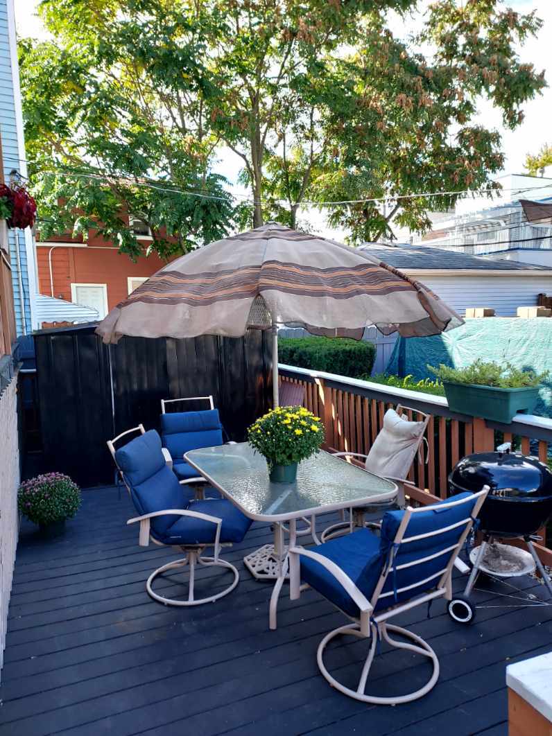 Community patio with table/ chairs/ grille. - 2516 W Lyndale St