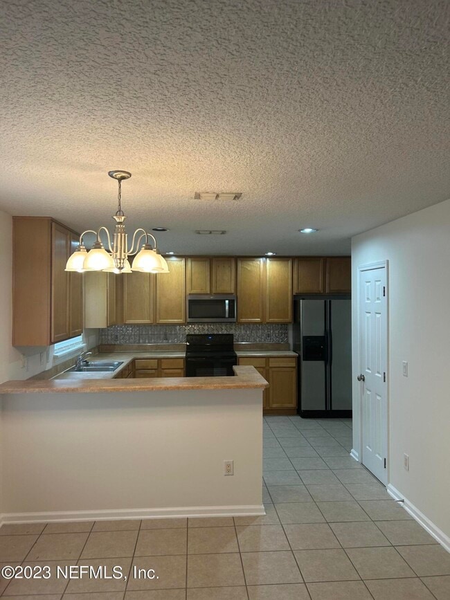 Building Photo - 1603 Canopy Oaks Dr