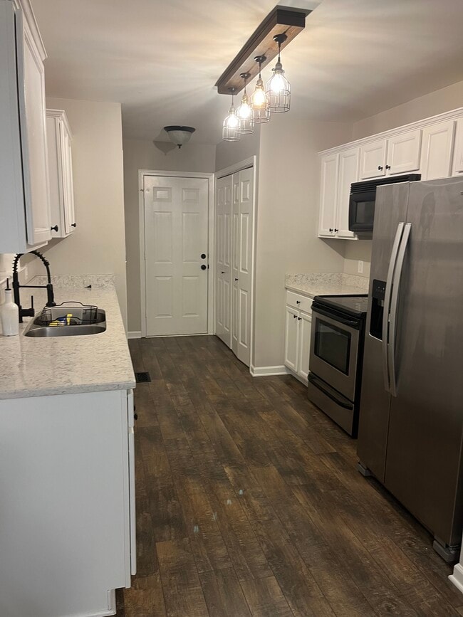 Galley Kitchen& Laundry behind closet doors - 542 Rogers Ln