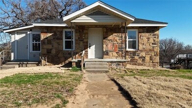 Building Photo - Studio Apartment with bathroom, kitchen & utility area on the lower level of property.