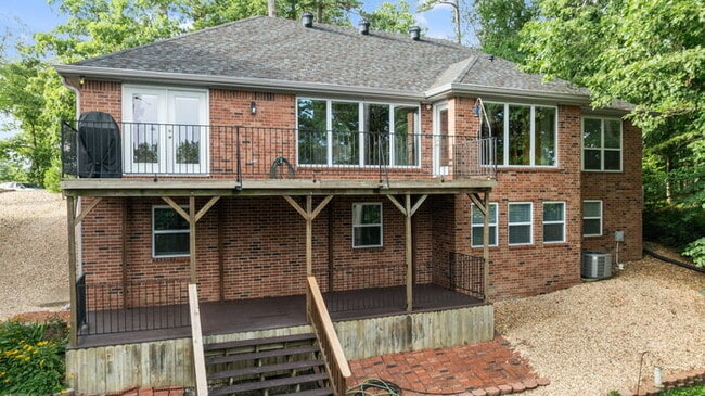 Building Photo - Serene Bella Vista Lakeside 4 bedroom