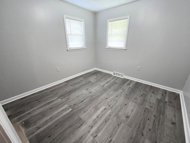 Building Photo - 3/2 with Fenced Yard; In-town and Near an ...