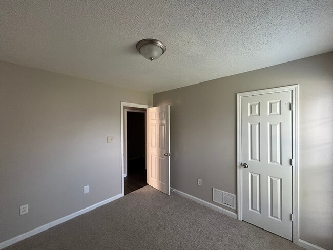 Building Photo - Spacious 4BR/2BA Olive Branch Home | 1,965 Sq Ft, Modern Fireplace, Bay Window & 2-Car Garage